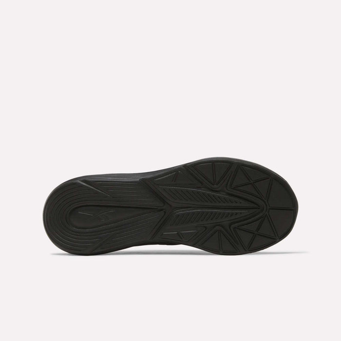 The black rubber sole of the Reebok Rush Runner 6.0 Running Shoes - Big Kids features a geometric tread pattern and EVA midsole, shown from the bottom against a plain white background.