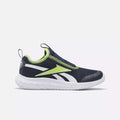 The Reebok Rush Runner Slip-On Shoes for little kids in Vector Navy, Digital Lime, and White feature lightweight cushioning, a breathable mesh upper, white accents, and a durable white sole, shown from the side against a plain background.