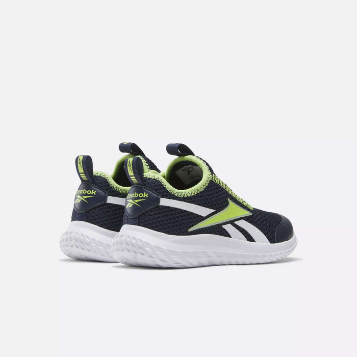 A pair of Reebok Rush Runner Slip-On Shoes for little kids in navy blue with white soles, neon green and white accents, lightweight cushioning, and heel pull tabs, shown on a light gray background.