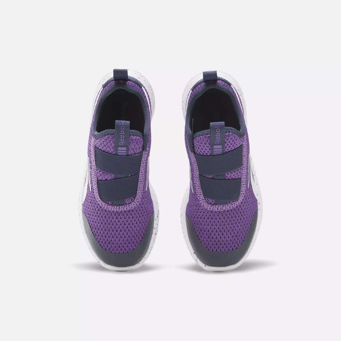 The Reebok Rush Runner Slip-On Shoes for little kids feature purple and navy mesh uppers, elastic bands on top, and white speckled soles—shown from above on a white background, ideal as girls' running shoes.