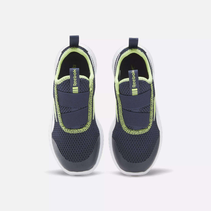 A top view of Reebok Rush Runner Slip-On Shoes for little kids in navy blue mesh with neon yellow accents and white soles, featuring lightweight cushioning and shown side by side on a light background.