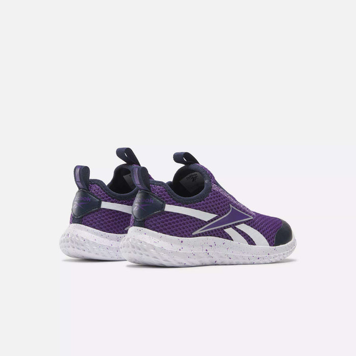 The Rush Runner Slip-On Shoes for little kids by Reebok feature a purple and black design with white soles and side stripes, shown from the back and at an angle against a plain light background.
