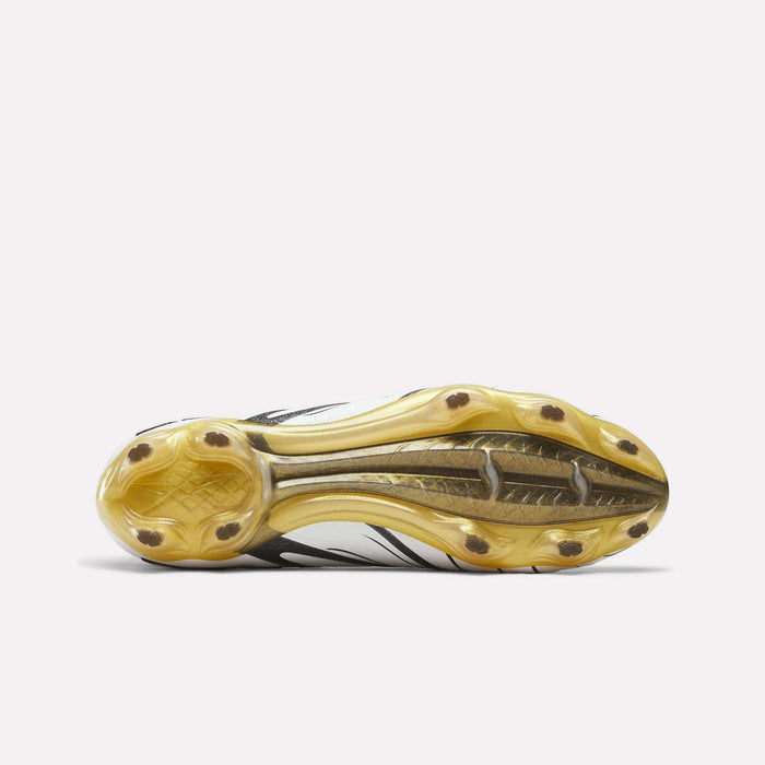 The image showcases the yellow, transparent sole with cleat studs of the Reebok Sidewinder 26 Elite Firm Ground Cleats, viewed from the bottom against a plain white background—ideal for firm grass surfaces and engineered to enhance ball control.