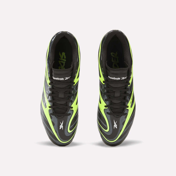 Top view of black and neon green Reebok Sidewinder 26 League FG Cleats for big kids, featuring black laces, firm ground studs, and prominent Reebok logos on the tongues and sides, placed side by side on a plain white background.