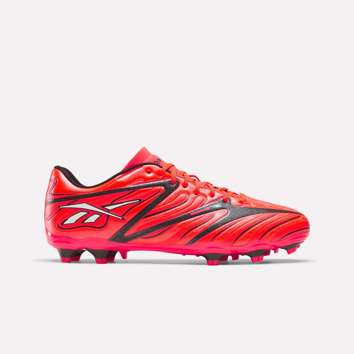 The Reebok Sidewinder 26 League Firm Ground Cleats come in an eye-catching Neon Cherry and Rival Red with black accents, featuring the iconic Reebok logo on the side. These soccer cleats are designed with red laces and molded firm ground studs on the sole, providing excellent traction and ball control—making them ideal for firm ground play.
