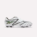 The Reebok Sidewinder 26 League Firm Ground Cleats in White/Black/Silver feature black wave-like patterns, iridescent silver accents on the sides, white laces, and firm ground studs for enhanced ball control, displayed on a plain background.