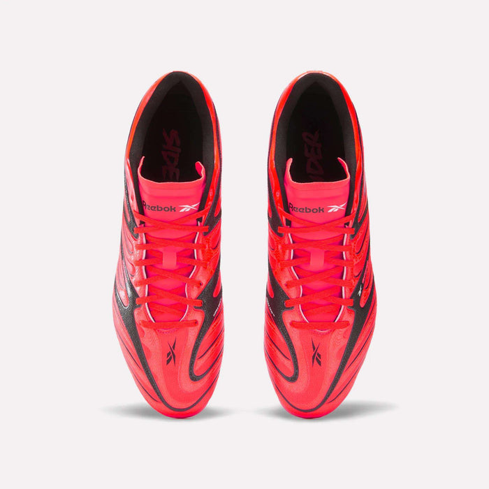 Top view of a pair of Reebok Sidewinder 26 League Firm Ground Cleats in bright pink and black with laces, featuring firm ground studs for enhanced ball control, placed side by side on a white background.
