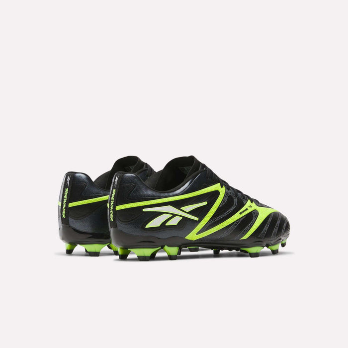 The Reebok Sidewinder 26 League Firm Ground Soccer Cleats in black and neon green feature bold side logos and firm ground studs, shown on a plain light background with back and side views.