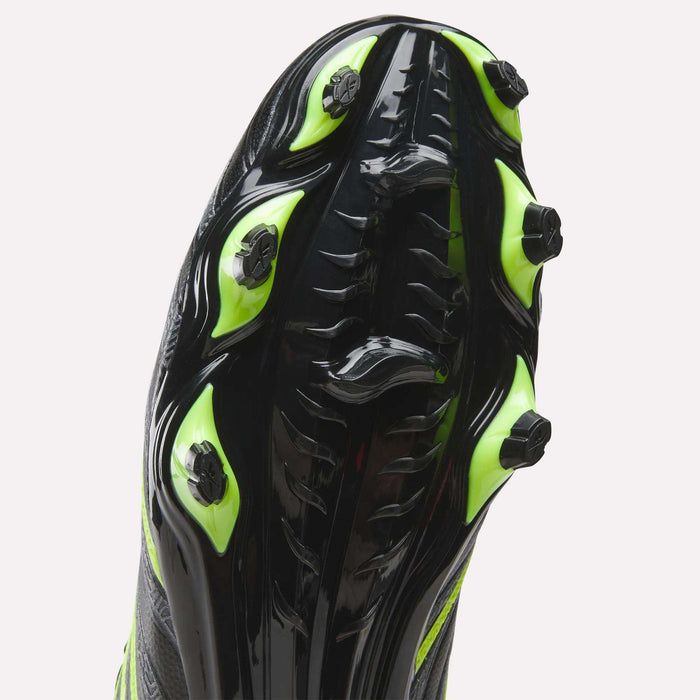 Close-up of the sole of Reebok Sidewinder 26 League Firm Ground Soccer Cleats in black with neon green studs, highlighting the traction pattern and design for enhanced ball control.