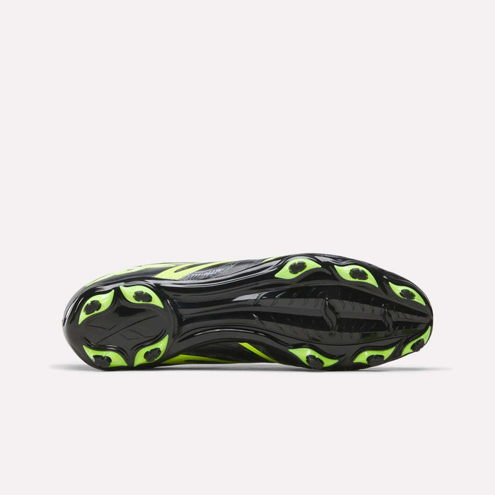 The image shows the sole view of the Reebok Sidewinder 26 League Firm Ground Soccer Cleats, featuring a black sole with neon yellow accents and multiple firm ground studs for enhanced traction and ball control.