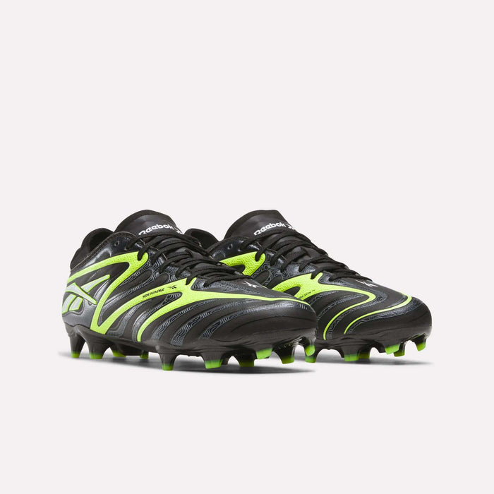The Reebok Sidewinder 26 Pro FG Cleats are black soccer shoes with neon green and silver accents, curved stripes, and molded green-tipped studs for firm ground play, enhancing ball control; shown on a plain white background.