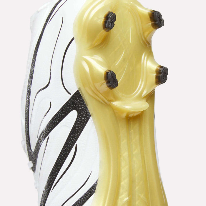 Close-up of the sole of the Reebok Sidewinder 26 Pro Firm Ground Cleats, featuring a translucent yellow bottom with black studs and a white upper adorned with black abstract patterns for enhanced ball control.