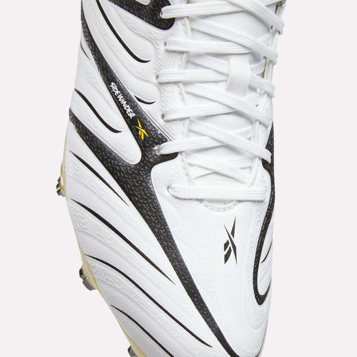 Close-up of the Reebok Sidewinder 26 Pro Firm Ground Cleats in white, showcasing black curved patterns, white laces, and a small black and yellow Reebok logo. Engineered for firm ground play, these cleats feature textured detailing and visible stitching to improve ball control.