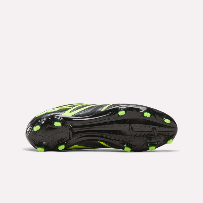 The image displays the Reebok Sidewinder 26 Pro FG Cleats—a black soccer shoe with neon yellow and green highlights. Designed for firm ground, it features multiple green-tipped studs for traction and ball control on a white background.