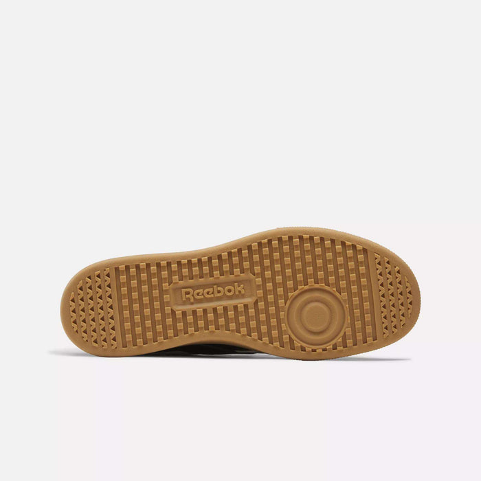 A close-up of the Reebok Smash Edge Shoes showcases their minimalist design, drawing inspiration from classic court style.