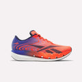 A dynamic red, white, and blue Reebok SpeedShifter Running Shoe with a thick white and black sole featuring innovative HyperFloat foam, a gradient design, and lace-up closure, shown from the side against a plain background.
