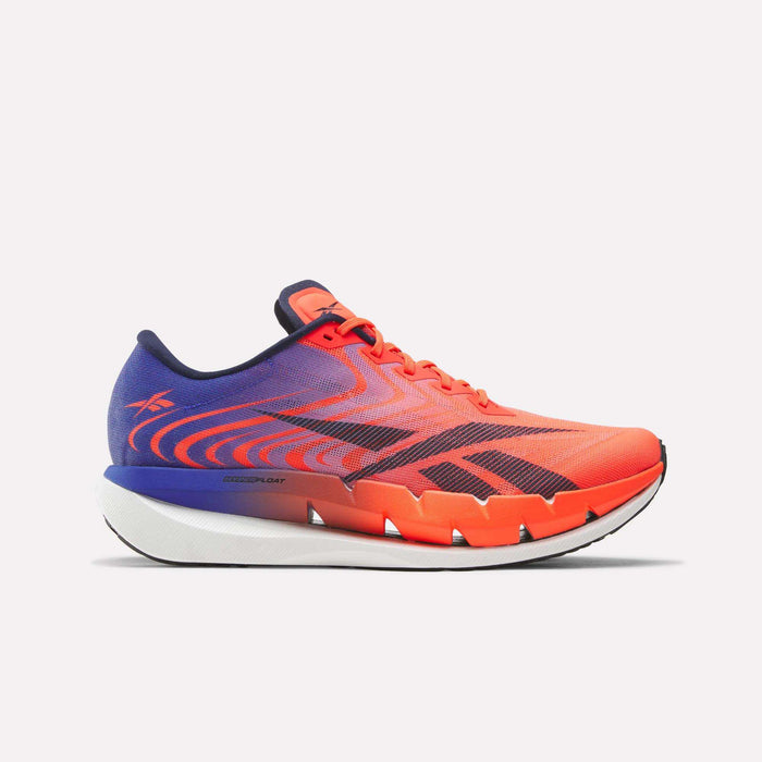 A dynamic red, white, and blue Reebok SpeedShifter Running Shoe with a thick white and black sole featuring innovative HyperFloat foam, a gradient design, and lace-up closure, shown from the side against a plain background.