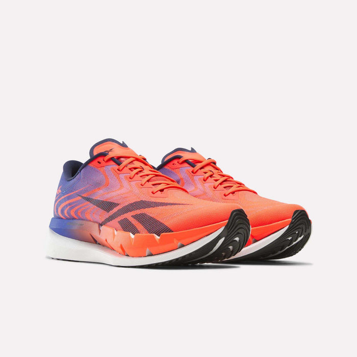 A pair of Reebok SpeedShifter Running Shoes in vibrant orange and purple, featuring black accents, HyperFloat foam cushioning, and white soles, are positioned side by side on a plain light background.