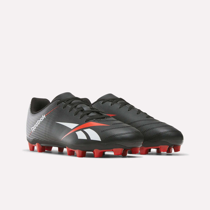 A pair of Reebok Strike Multi Ground Soccer Cleats featuring a black synthetic upper with white and red accents, complemented by red studs on the soles, displayed on a plain white background.