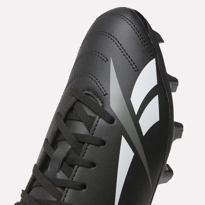 A close-up of the Reebok Strike Multi Ground Soccer Cleats in black, featuring white and gray graphic details, with visible laces and part of the sole displaying turf studs.