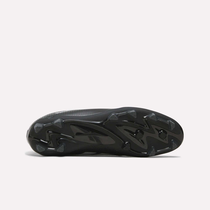 The image displays the black, textured sole of the Reebok Strike Multi Ground Soccer Cleats, featuring molded studs for turf traction, as seen from the bottom against a plain white background.