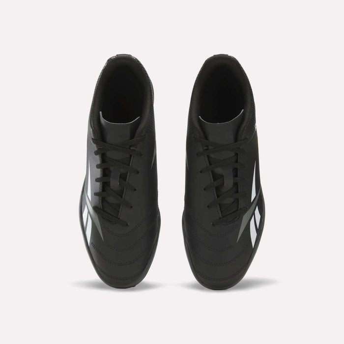Top view of a pair of Reebok Strike Turf Soccer Shoes in black with white accents and black laces, placed side by side on a plain white background—perfect for soccer practice.