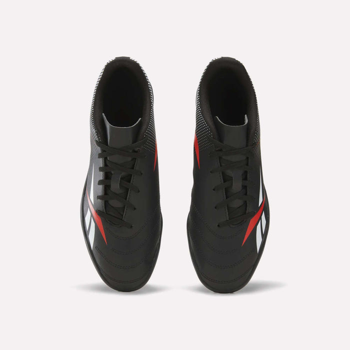 A top-down view of Reebok Strike Turf Soccer Shoes in black with red and white accents, set against a clean white background.