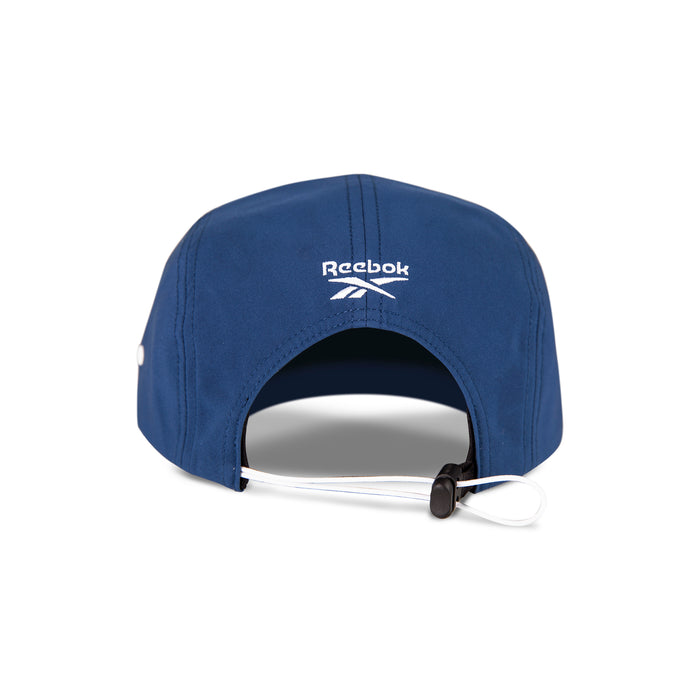 Back view of the blue Reebok Technical Running Cap With Drawcord, featuring a white logo above the adjustable strap with black toggle and white cord. Made from recycled materials, this eco-friendly cap is displayed on a white background.