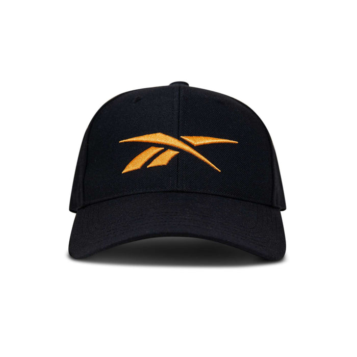 The Reebok Vector Baseball Cap is black with a large yellow embroidered logo on the front, displayed against a white background.