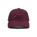 The Vector Baseball Cap by Reebok is maroon with a matching embroidered logo on the front, displayed against a white background.