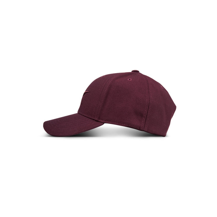 The Reebok Vector Baseball Cap, shown in burgundy on a white background, features a curved brim and visible stitching. Displayed from a side view, it highlights the cap's simple and classic design.