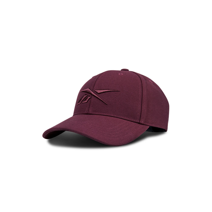 The Reebok Vector Baseball Cap in maroon features a curved brim and an embroidered Reebok logo on the front, displayed against a white background.
