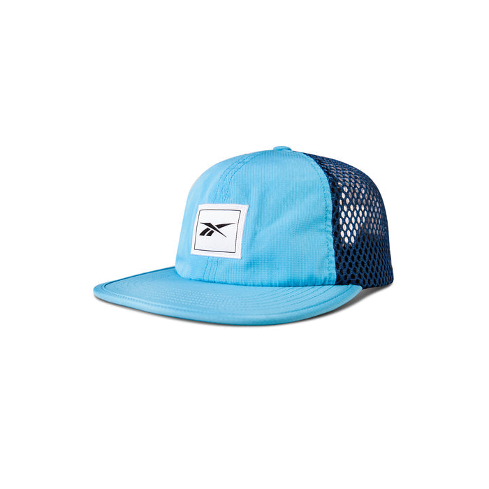 The Reebok Vented Flat Brim Running Cap in light blue features a black mesh back for breathability and a white front patch with a black logo, displayed on a white background.