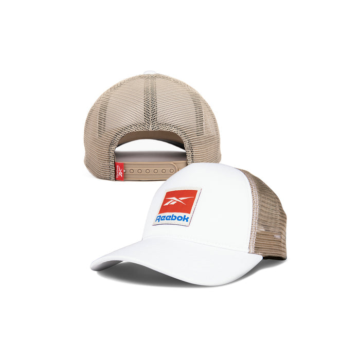 The Reebok Vintage Trucker Cap in white and beige features a red and blue front logo, mesh panels, and an adjustable snapback closure, highlighting its athletic heritage from multiple angles.