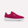 The Reebok Women's Active Lite Shoes are shown in bright pink with DMX technology, a mesh upper, white sole, and laces. Displayed in side profile against a plain light background.
