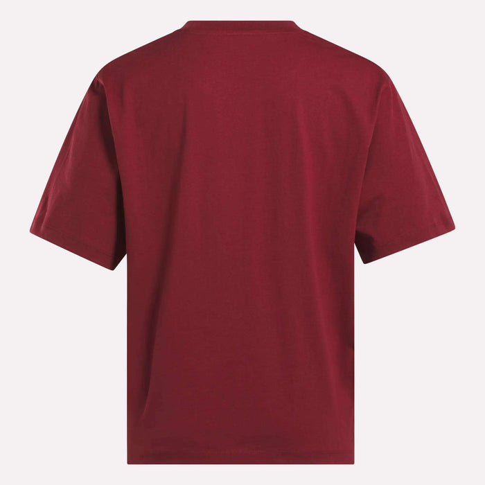 A Women's Big Logo Oversized Crew Short Sleeve Tee by Reebok in plain maroon, shown from the back against a white background.
