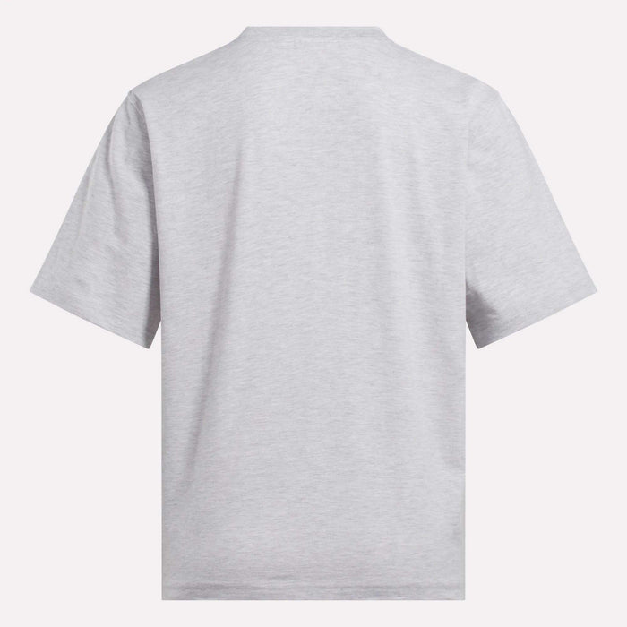 The Reebok Women's Big Logo Oversized Crew Short Sleeve Tee is shown from the back in light gray, featuring an oversized fit and simple crew neckline against a white background, with no visible designs or logos.