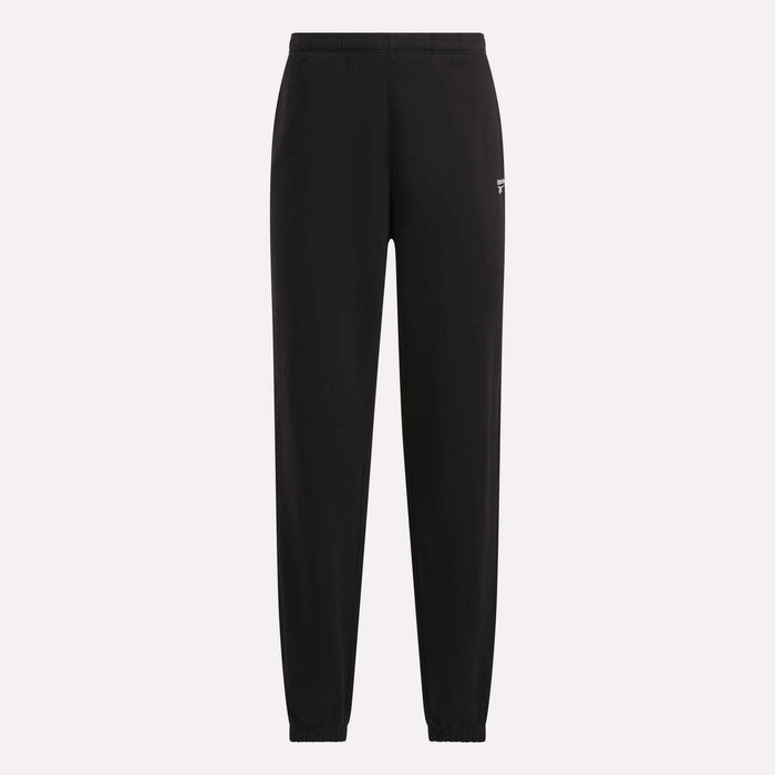The Reebok Women’s Cinch Sweatpants are black athletic sweatpants featuring an elastic waistband and ankle cuffs, displayed on a plain light background. Designed with a modern look, these sweatpants showcase a small white Reebok logo on the upper left thigh.