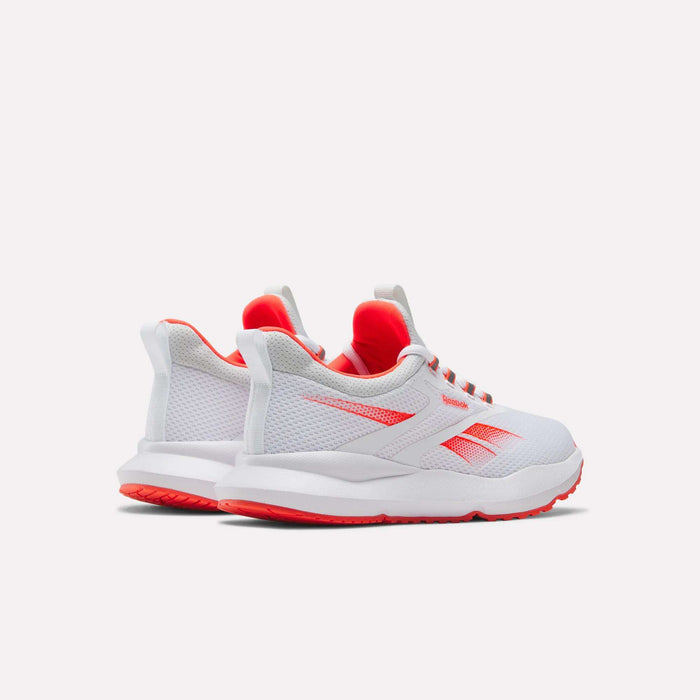 The Reebok Women's Cityride 2 Running Shoes are shown in white with red accents and soles, featuring breathable mesh, the Reebok side logo, and comfortable FuelFoam cushioning against a plain light background.