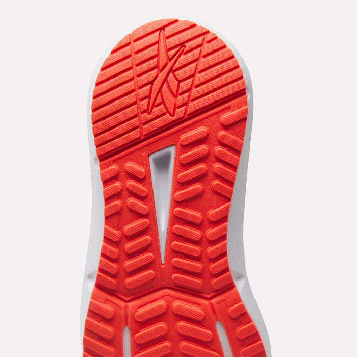 Close-up of the bright red and white outsole on Reebok Women's Cityride 2 Running Shoes, showing grooved traction, FuelFoam cushioning for comfort, and a stylized logo near the top.