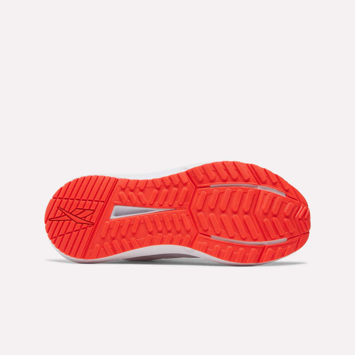 The image shows the bright red-orange rubber outsole of a Reebok Women's Cityride 2 Running Shoe, featuring a patterned tread for traction, a central slit, and a stylized Reebok logo on the left side.