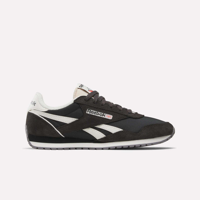 The Reebok Women's Classic AZ Shoes feature black and white suede and leather details, signature white side stripes, a black sole, and the Reebok logo on the side and tongue—all shown against a plain white background.