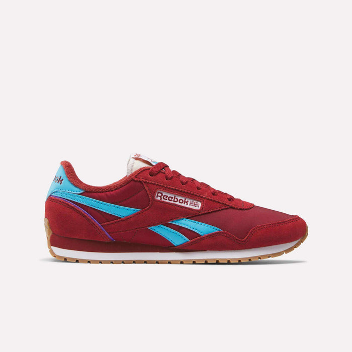 The Women's Classic AZ Shoes by Reebok feature a red design with blue accents, white midsole, gum outsole, and the signature Reebok logo on the side and heel. Shown on a plain white background, they're perfect for fans of classic running style.