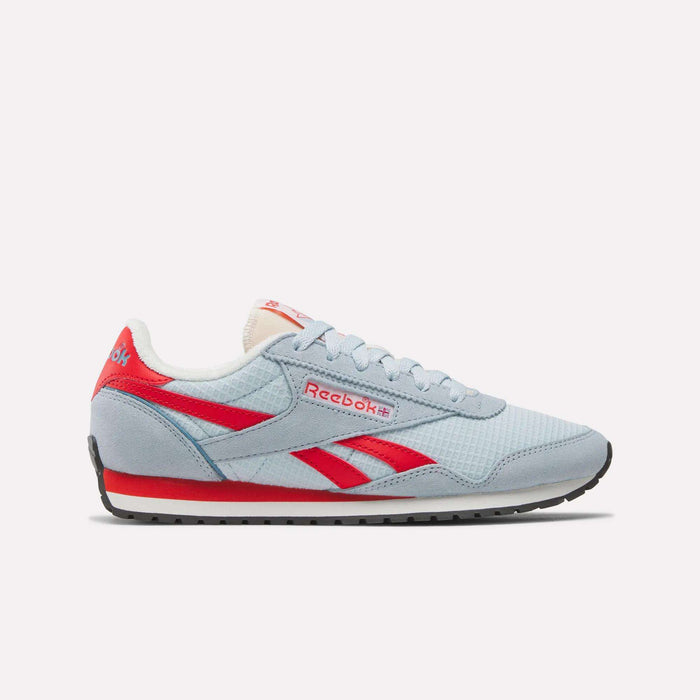 The Reebok Women's Classic AZ Shoes feature a light blue upper, red accents, white sole, and black tread in a retro running-inspired design, shown in side profile on a plain white background.