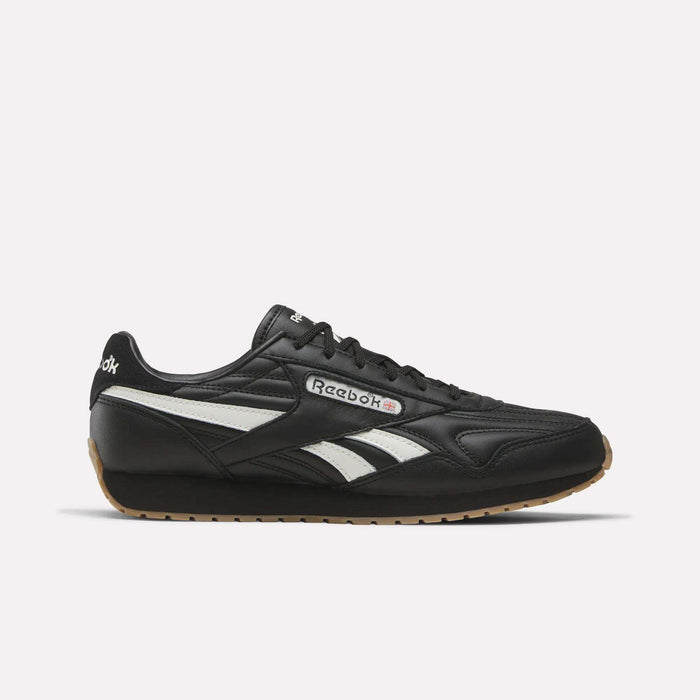 Black Reebok Women’s Classic AZ Shoes in Black/Chalk/Gum, featuring white side stripes and a gum rubber sole, shown in a side view against a plain white background—an iconic choice for women’s footwear.