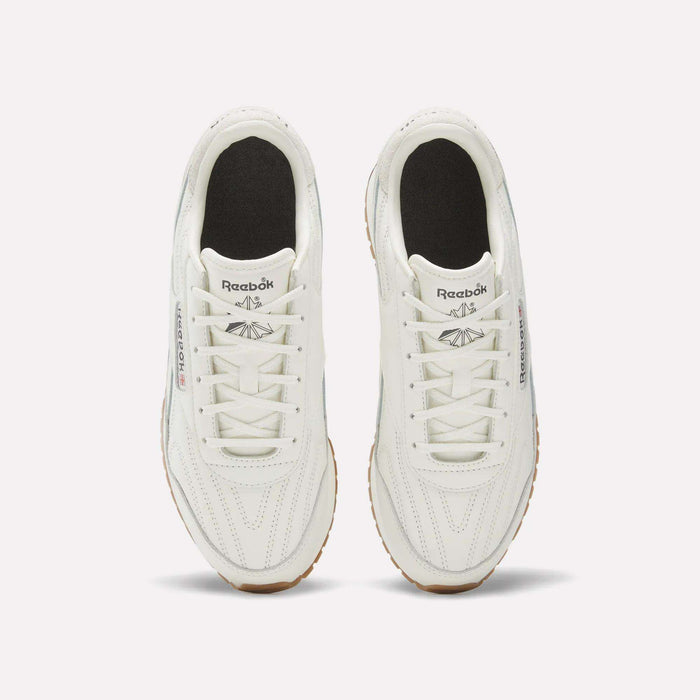 A pair of Reebok Women's Classic AZ Shoes, featuring a premium leather upper and gum soles, are shown from above on a plain light background, highlighting their black insoles and white laces.