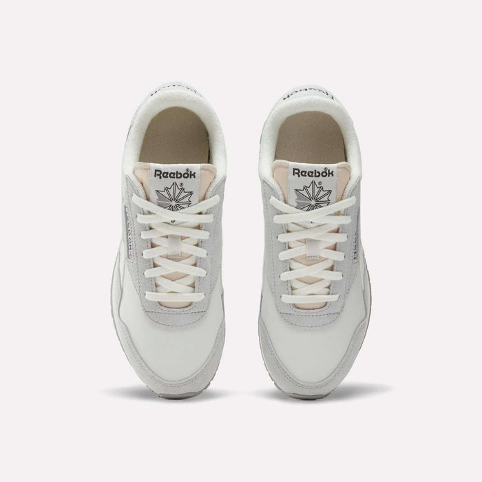 Top view of a pair of Women's Classic AZ Shoes by Reebok in white and light gray with white laces, low-profile design, and the Reebok logo visible on each tongue, displayed side by side on a plain background.