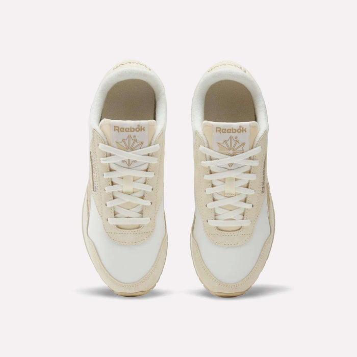 Top view of Women's Classic AZ Shoes by Reebok featuring a low-profile design in white with beige accents, white laces, and Reebok branding on each tongue.