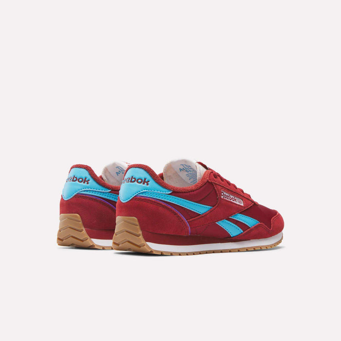 The Reebok Women's Classic AZ Shoes in red with blue accents and gum soles are displayed from the back and side, highlighting their vintage-inspired design against a plain white background.