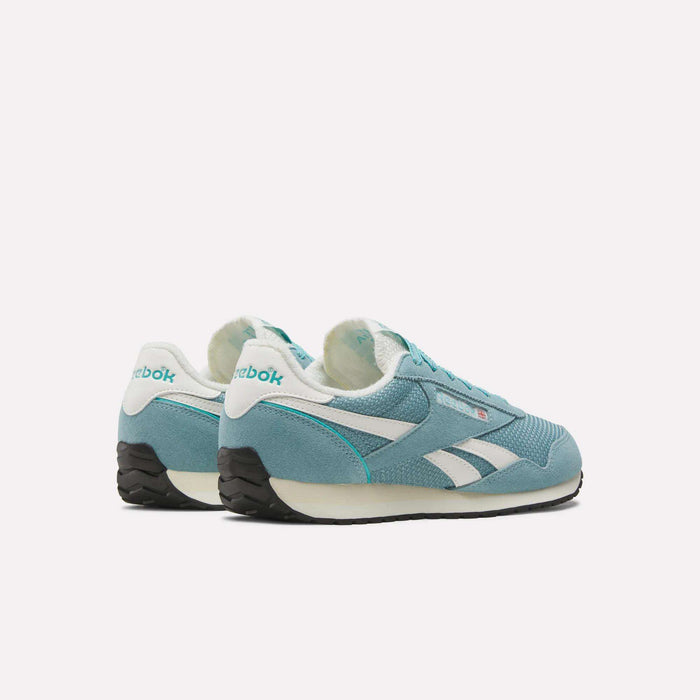 A pair of Women’s Classic AZ Shoes by Reebok in teal and white with black soles are displayed on a white background, angled to showcase the side and back logos. The textured design emphasizes both style and comfort, making them ideal for everyday wear.